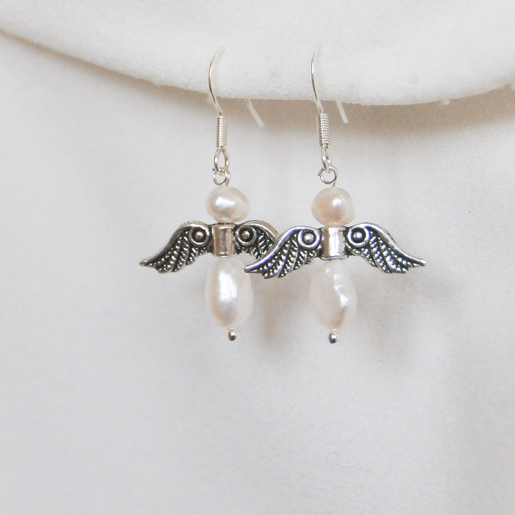 Angel earrings hot sale